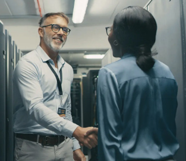 Professionals in a meeting discussing IT strategy and planning