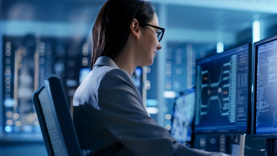 Person working on a server rack, symbolizing IT infrastructure