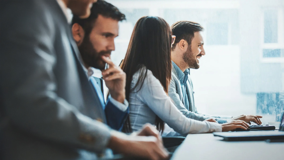 Professionals collaborating on a technology solution